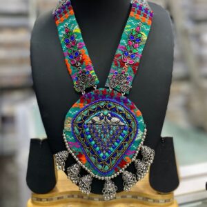 Exquisite Navratri Jewelry: Vibrant Threadwork and Intricate Silver Necklace Sets