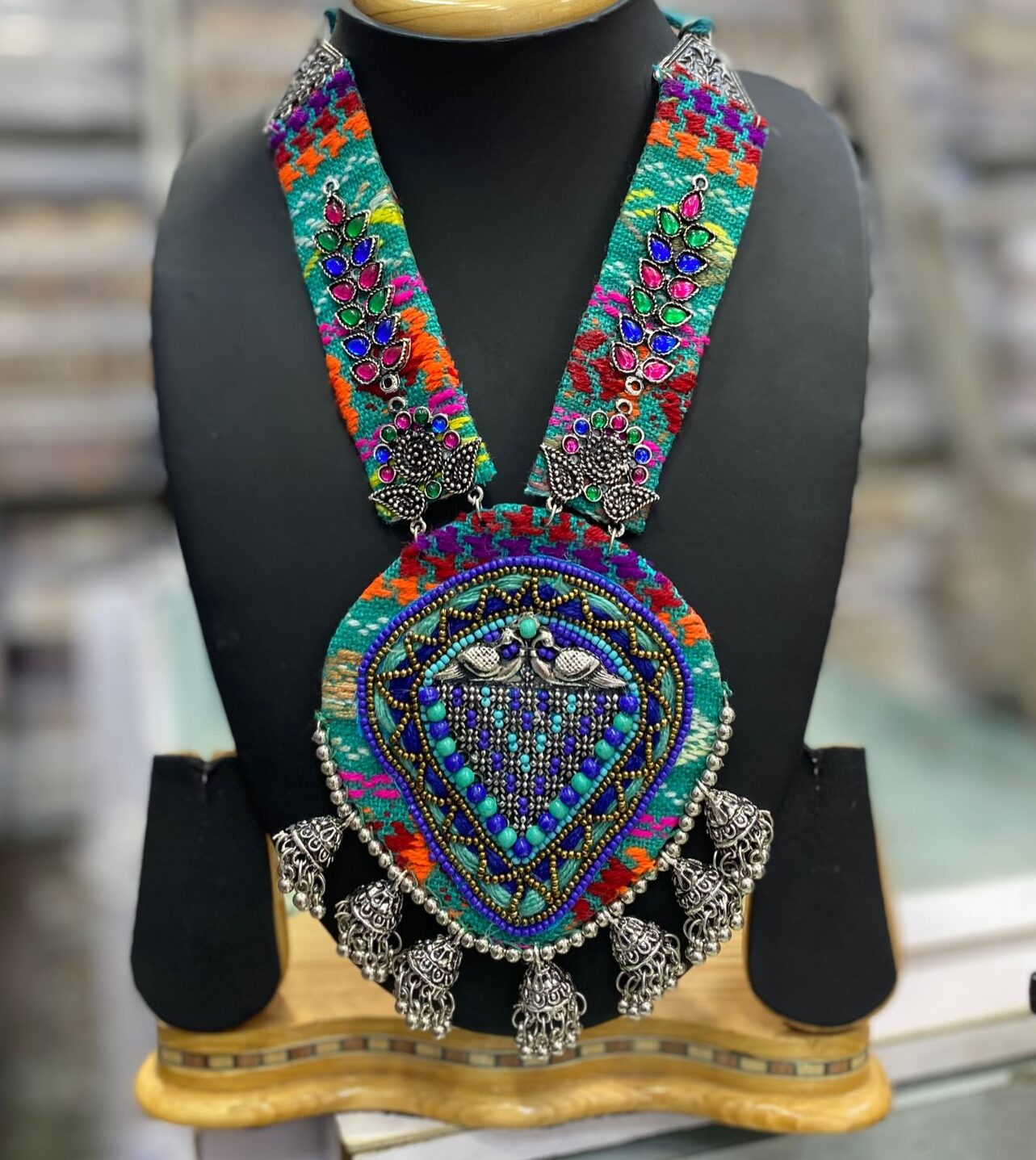 Exquisite Navratri Jewelry: Vibrant Threadwork and Intricate Silver Necklace Sets