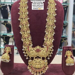 Trending Temple Long Haram Necklace with Goddess Lakshmi, Ruby Stones, White Pearls & Peacock Design