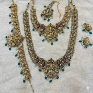 Antique Gold Plated Lakshmi Long Haram, Necklace, Earrings, Maang Tikka & Hip Belt (Green & Maroon) | Wedding & Festive Wear