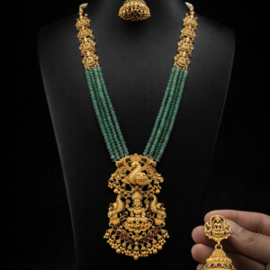South Indian Temple Jewellery Long Haram Necklace Set with Goddess Lakshmi Pendant & Jhumka Earrings – Antique Gold Nagas Bridal Jewellery (Maroon & Green Beads)