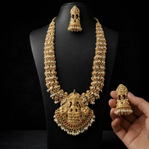 South Indian Temple Jewellery Long Haram Necklace Set with Goddess Lakshmi Pendant & Pearl Jhumka Earrings – Traditional Bridal Gold Plated Jewellery Set for Women