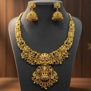 Antique Matte Finish Short Necklace with Goddess Lakshmi Pendant, Peacock Motifs, Ruby & Emerald Stones, and Matching Jhumka Earrings