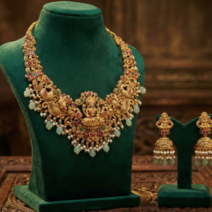 Traditional Lakshmi & Peacock Motif Short Necklace with Matching Jhumka Earrings | Ruby, Emerald & Pearl Accents for Weddings and Festivals