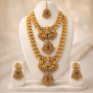 South Indian Temple Jewellery Lakshmi Long Haram & Short Necklace Combo Set with Jhumka Earrings and Maang Tikka – Antique Gold Polish Bridal Necklace Set for Women