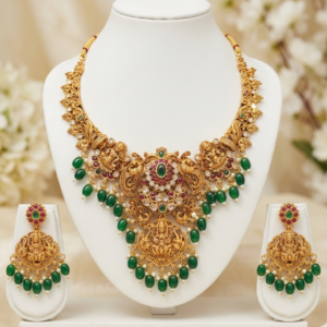 Antique Gold Plated South Indian Temple Necklace Set with Goddess Lakshmi Motifs, Peacock Carvings, and Green Bead Droplets