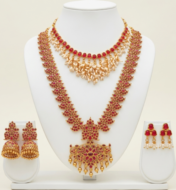 Gold plated bridal jewellery set with long haar, choker and earrings in ruby red