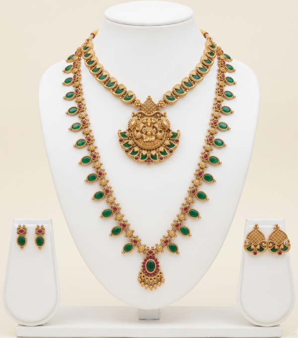 South Indian green long haram and Lakshmi pendant necklace set with earrings in matte gold finish