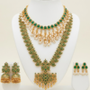Gold plated bridal jewellery set with long haar, choker and earrings in emerald green