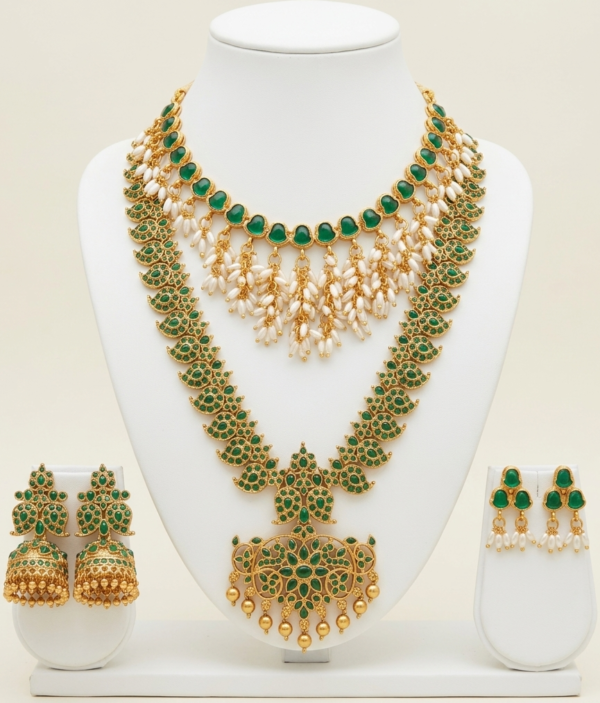 Gold plated bridal jewellery set with long haar, choker and earrings in emerald green