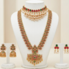 Gold plated bridal jewellery set with long haar, choker and earrings in ruby red and emerald green