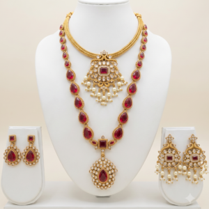 South Indian ruby stone long and short necklace set with matte gold finish, pearl drops and two pairs of earrings