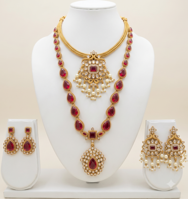 South Indian ruby stone long and short necklace set with matte gold finish, pearl drops and two pairs of earrings