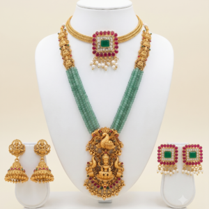 South Indian matte gold Lakshmi green beads long haram and ruby green choker combo with two pairs of earrings