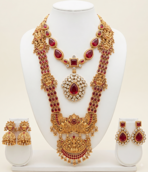 Traditional gold plated temple jewellery set with long haar, necklace and earrings in ruby red
