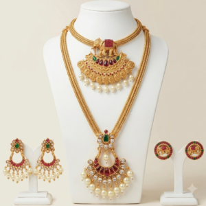Antique gold elephant choker and long haram combo with pearl drop and elephant stud earrings
