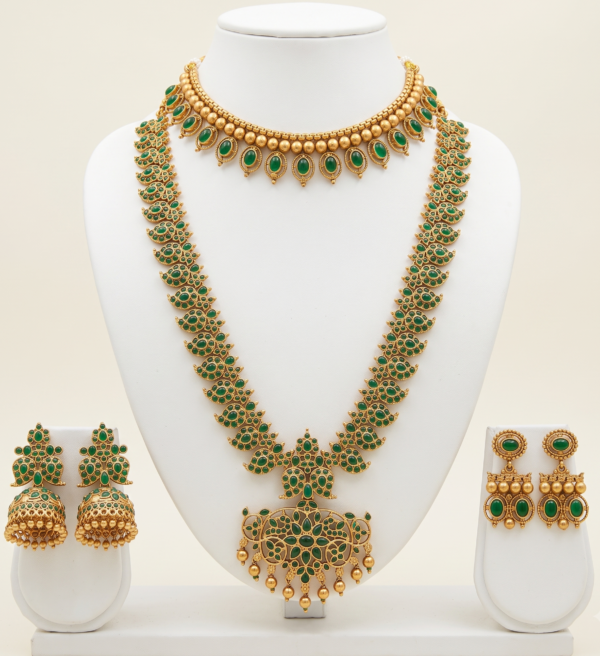 Traditional gold plated long haar and choker jewellery set with earrings in emerald green