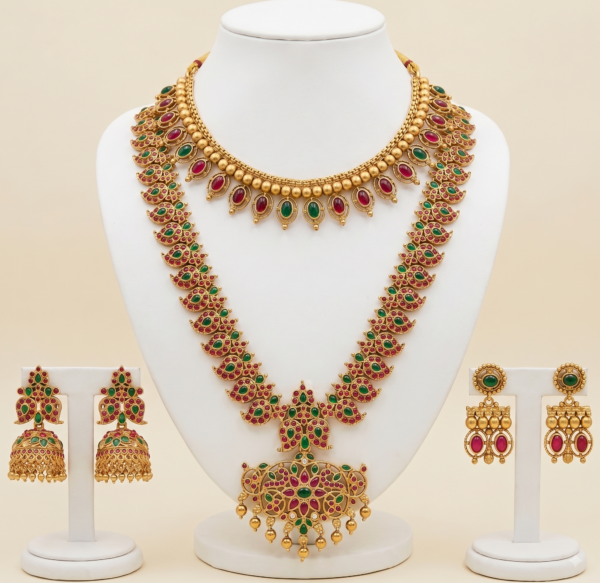 Traditional gold plated long haar and choker jewellery set with earrings in red and green multicolor