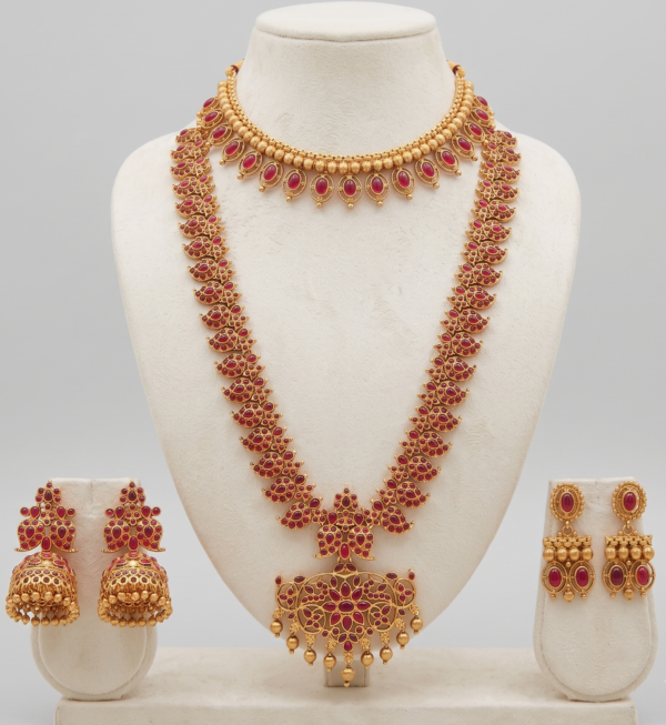 Traditional gold plated long haar and choker jewellery set with earrings in ruby red