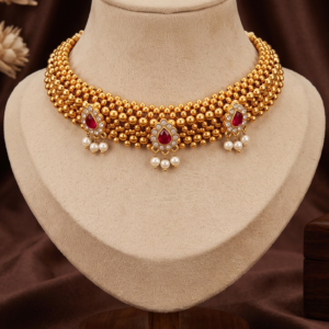 Maharashtrian gold plated Thushi choker necklace with ruby-colour stones and pearl-style hanging beads