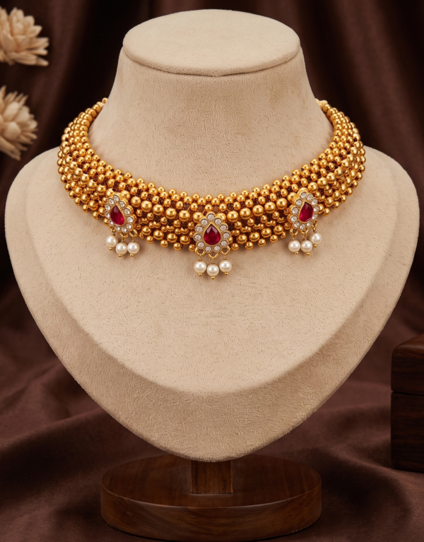 Maharashtrian gold plated Thushi choker necklace with ruby-colour stones and pearl-style hanging beads