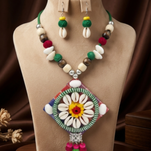 Navratri cowrie shell diamond pendant thread necklace set with matching earrings