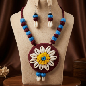 Navratri maroon and blue cowrie shell thread statement necklace set with earrings