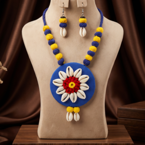 Navratri blue and yellow cowrie shell thread statement necklace set with earrings