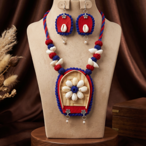 Navratri red and blue cowrie shell thread statement necklace set with earrings