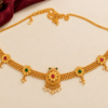 Gold finish Kamarpatta waist chain with floral ruby green stone motifs, pearl-style drops and adjustable hook chain.
