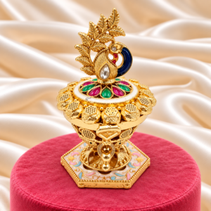 Blue peacock kumkum box with leaf motif and decorative floral base