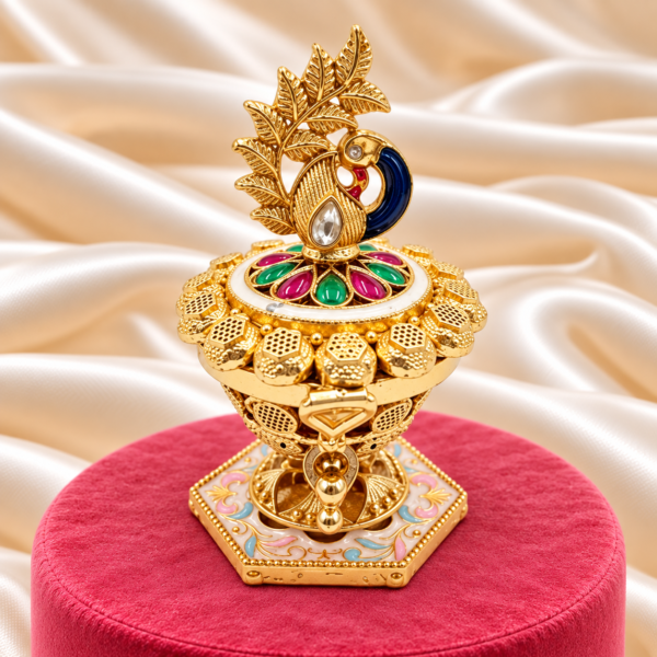 Blue peacock kumkum box with leaf motif and decorative floral base