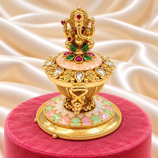 Lord Ganesha kumkum box with pink floral design and decorative stones