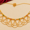 Traditional gold finish Kamarpatta waist belt with ruby-red, emerald-green and white floral stones, mesh band and cascading gold-tone bead chains.